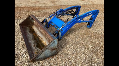 new holland skid steer bucket release|new holland 16la loader bucket.